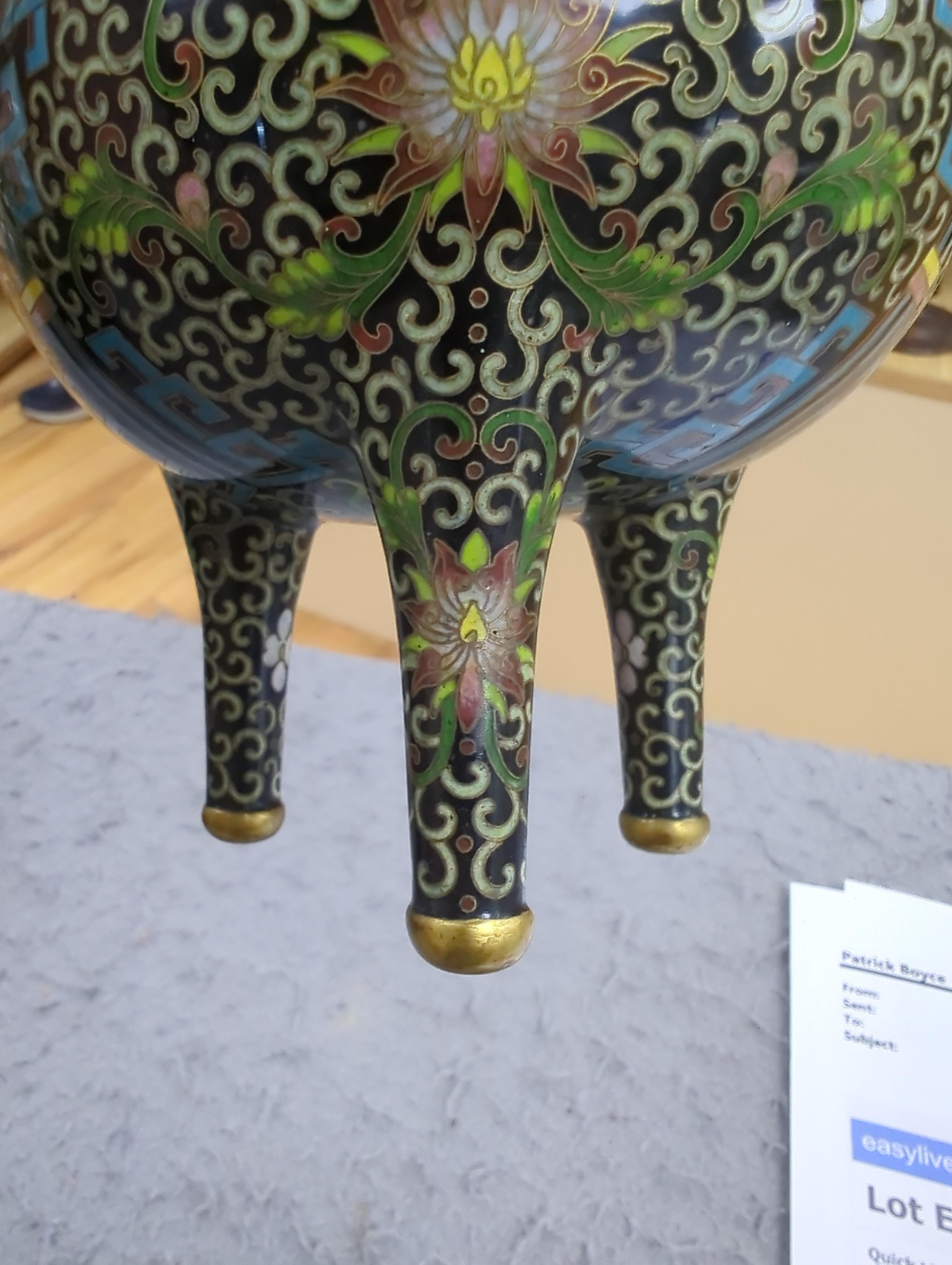 A Chinese cloisonné enamel three footed vase and cover together with a censer and cover, each raised on hardwood stands, the largest 26cm in diameter